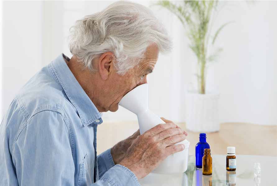 older man inhalation with essential oils